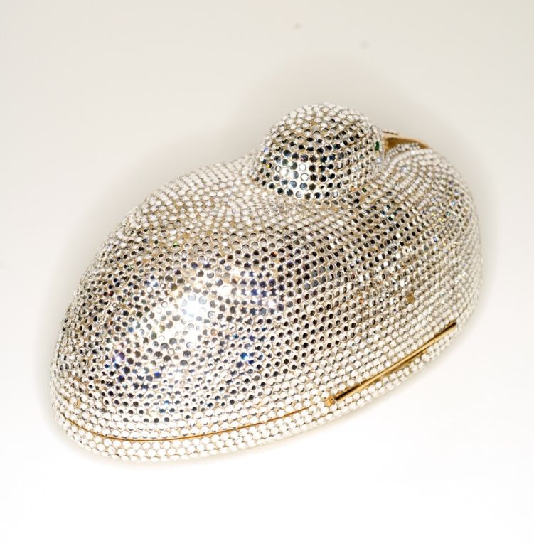 Stunning and whimsical hand beaded Austrian crystal Judith Leiber duck minaudiere.  Gold hardware.  Comes with its original gold leather coin purse, mirror and comb.