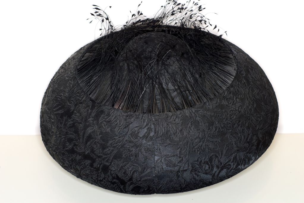 An incredible Phillip Treacy hat made from a vintage brocade and a crown of burnt feathers.<br />
<br />
RARE vintage<br />
STORE HOURS: Monday to Friday 11:30 to 6PM<br />
Weekends by appointment. <br />
24 West 57th Street<br />
Fifth