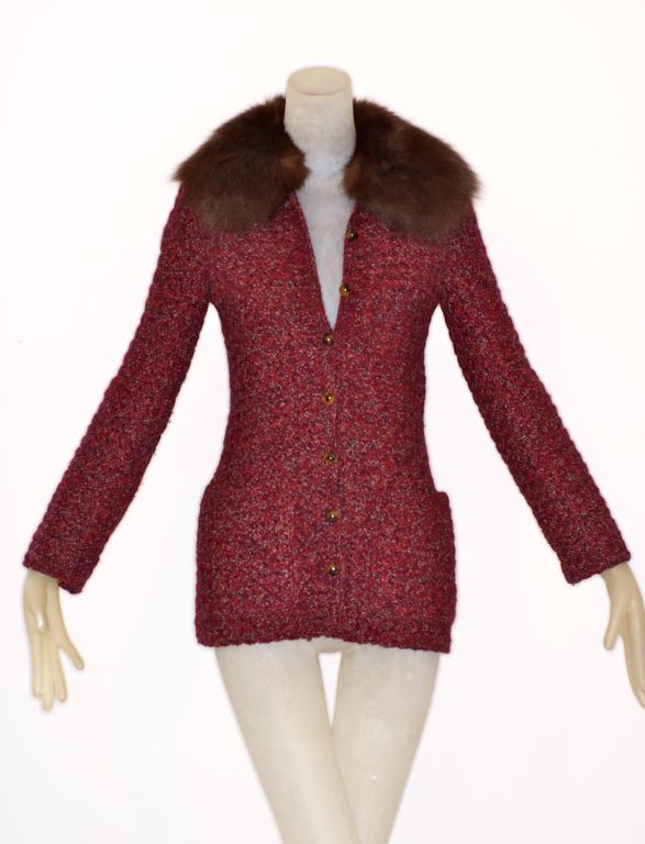 A beautiful, stunning hand crocheted sweater with a fur collar from the Hiver 1974 haute couture collection of Yves Saint Laurent.  In pristine condition.  An exceptional collector's piece as well as wearable.  The best of both worlds!  <br />
<br
