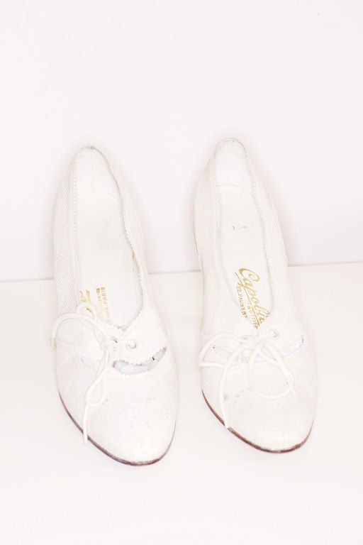Exceptional pair of 1970s Capobianco white python Spectator shoes.  Capobianco was a luxury shoe store in Paris near the Hermes store on rue du Faubourg Sant-Honoré founded in the 1930s.  <br />
<br />
Interior total length is about 10 1/2