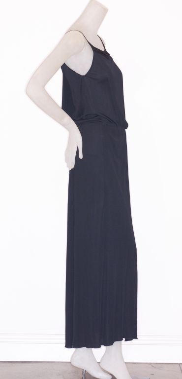 Sometimes it is all in the details like in this 1980s Gianni Versace for Callaghan black jersey gown with fringed detail on the bodice.<br />
<br />
RARE vintage <br />
STORE HOURS: Monday - Friday 11:30AM to 6PM<br />
Weekend Appointments