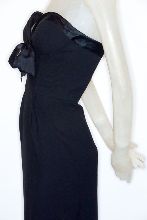 A rare and beautiful strapless 1950s jersey cocktail dress with silk ribbon detail by Emilio Schuberth.  Schuberth dressed Sophia Loren, Claudia Cardinale, Ava Gardner and Brigitte Bardot.  He also did films for many Italian films.  His dresses were
