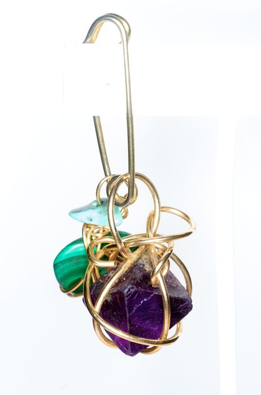Description: Kazuko Oshima's jewelry was sold exclusively at Barneys. Her jewelry was defined by its characteristic web of wire wrapped stones. Kazuko also was a firm believer in the healing powers of the materials she worked with. <br />
<br