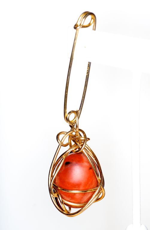 Kazuko Oshima's jewelry was sold exclusively at Barneys.  Her jewelry was defined by its characteristic web of wire wrapped stones.  Kazuko also was a firm believer in the healing powers of the materials she worked with.  <br />
<br />
Besides