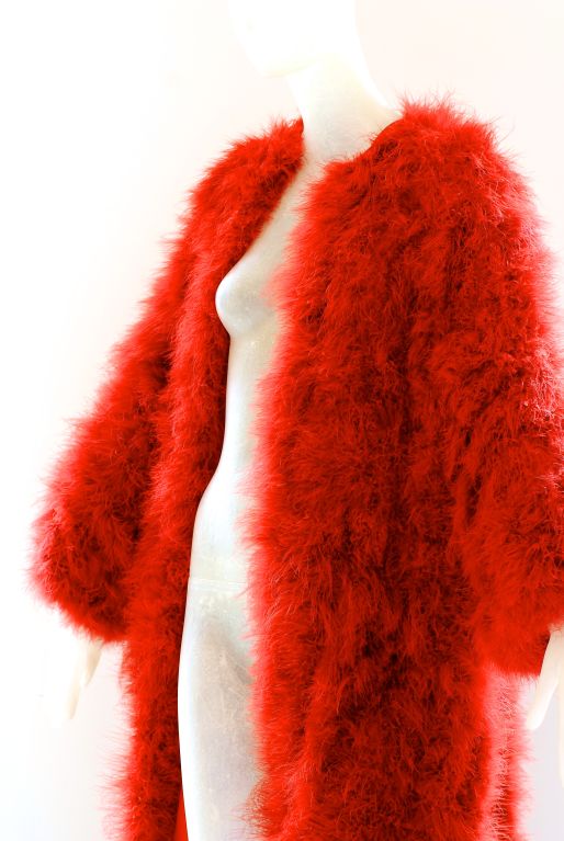 Extravagant Sonia Rykiel burnt orange feather coat.  Perfect when something spectacular and fun is needed.<br />
<br />
RARE vintage <br />
STORE HOURS: Monday - Friday 11:30AM to 6PM<br />
Weekend Appointments Available<br />
24 West 57th