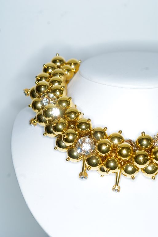 A fun and fabulous collar necklace with gold metal beads interspersed with rhinestone tipped 'nails'.  Unsigned.<br />
<br />
RARE vintage<br />
STORE HOURS: Monday to Friday 11:30 to 6PM<br />
24 West 57th Street<br />
5th Floor<br />
in The