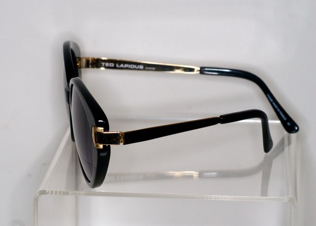 Glamorous Ted Lapidus cat eye sunglasses with gold detail.  Sunglasss are signed Ted Lapidus on outside arm.