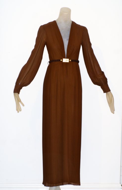 André Laug worked for Jules-Francois Crahay at Nina Ricci couture, Philip Venet and  André Courreges before opening his own house in Rome in 1968.  His brand is defined by luxurious materials, refinement and craft.<br />
<br />
This brown silk