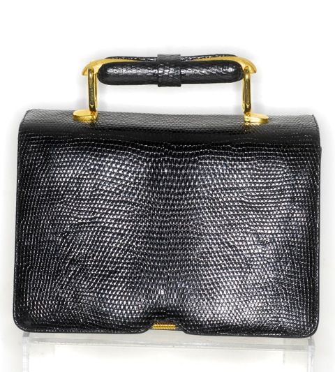 Adorable, elegant and chic small black lizard Judith Leiber bag with gold hardware and gold and lizard handle.  Interior has three pockets, a small mirror and a small black lizard coin purse.<br />
<br />
RARE vintage<br />
STORE HOURS: Monday to