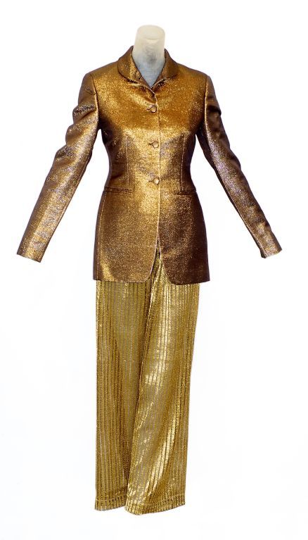 A beautiful fitted gold lame riding style jacket by Romeo Gigli.  Please note the woven transparent gold drawstring pants are not sold with the jacket.<br />
<br />
RARE vintage<br />
STORE HOURS: MONDAY TO FRIDAY: 11:30 to 6PM<br />
24 West