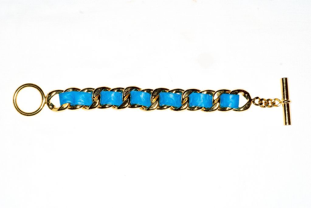 A classic Mediterranean blue leather laced Chanel chain bracelet.  Unsigned.  Vivid, brilliant, gorgeous color one of the key trends for resort.<br />
<br />
Length to ring: 6 1/2