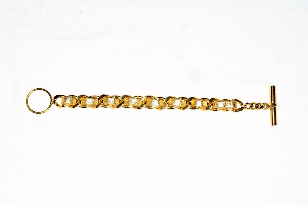 A great wearable classic by Chanel from the 1980s.  This chain link bracelet is woven with gold leather.  Unsigned.<br />
<br />
RARE vintage<br />
STORE HOURS: MONDAY TO FRIDAY 11:30 TO 6PM<br />
24 West 57th Street, Fifth floor<br