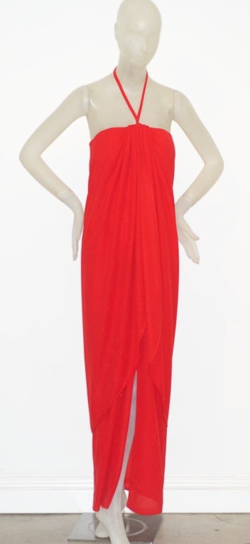 Incredibly glamorous Bill Blass red crepe halter gown from the 1970s with a fabulous detached hood.