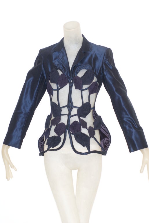 In Spring Summer 1991 Gaultier wanted to shake up the garden of Adam and Eve.  He reimagined them as modern day Rastafarians.  He wanted to reassemble men and women, masculine and feminine together.  This rare and beautiful midnight blue silk jacket