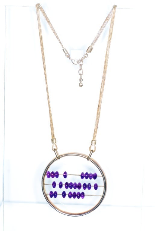 Jean Paul Gaultier Sterling Silver Abacus necklace with amethyst colored beads.

Total chain length: