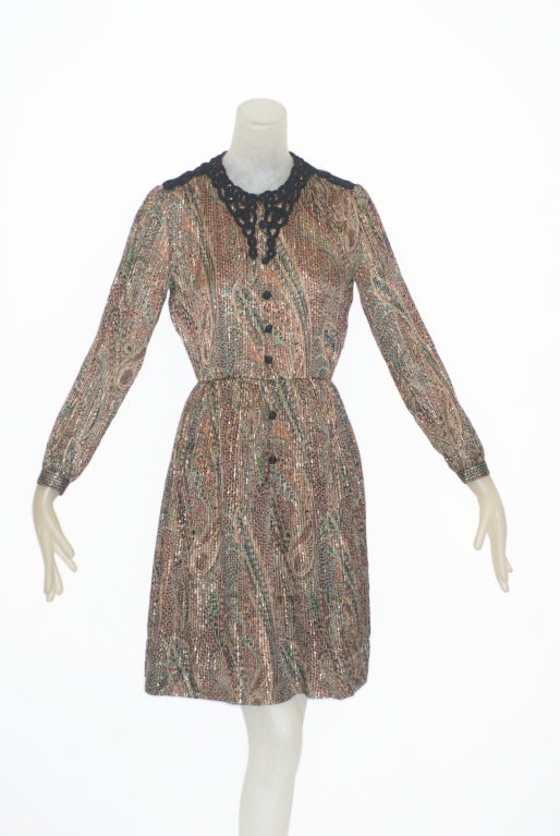 1970s Chanel Creations paisley print silk dress with flecks of metallic gold and clack cording detail around the neckline.  Perfect day to evening dress with a boho chic vibe.  One of our favorites!

Size 4

RARE vintage
STORE HOURS: Monday to