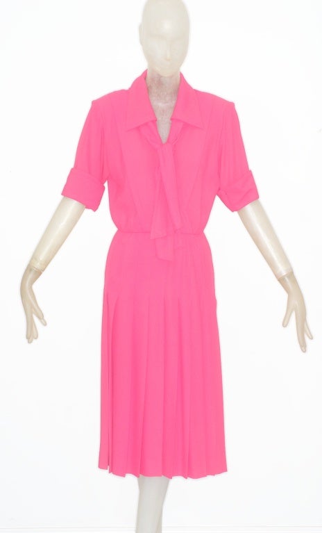 Bring a burst of color into your wardrobe with pink crepe Yves Saint Laurent rive gauche dress.