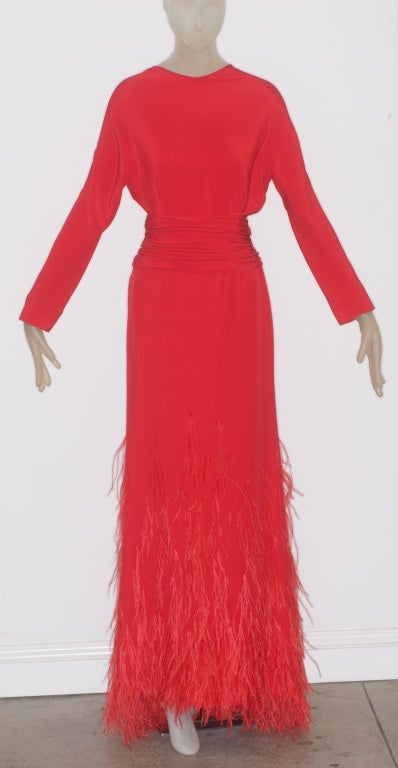 Gorgeous Valentino red gown with an open back, gathered waist band and feathers and small beads adorning the lower part of the dress.

Size 6/8

RARE vintage
STORE HOURS: Monday to Friday 11:30 to 6PM
in The New York Gallery Building

Please