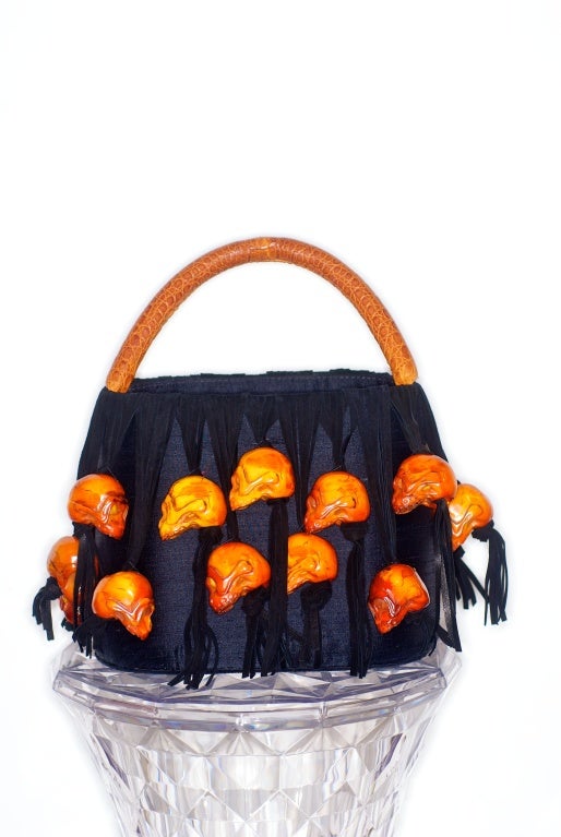 Roberta Balsamo whimsical bag with detailed black suede fringe and skulls.  Handle is crocodile.  Interior is lined in a raw silk.

RARE vintage
STORE HOURS: Monday to Friday 11:30 to 6PM
24 West 57th Street
Fifth floor
in The New York Gallery