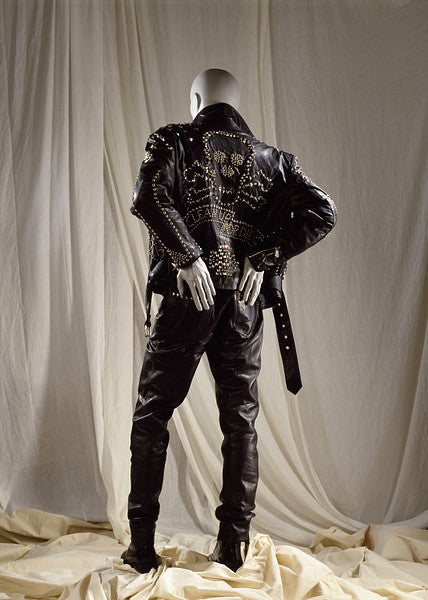 1990 Katherine Hamnett black leather motorcycle jacket from the 'Clean up or die' collection.  Jacket is embellished with studded with hearts, skull and crossbones, stars and on the back, Clean Up or Die.

The jacket is also in the collection of