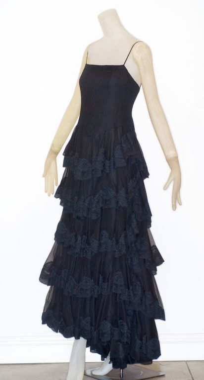 Valentino Couture circa 1978 romantic evening gown in silk organza and lace.  The fitted bodice is finely pintucked and the skirt which skims the hips, opens out to layers edged in lace.

Valentino Garavani is the most celebrated of all Italian