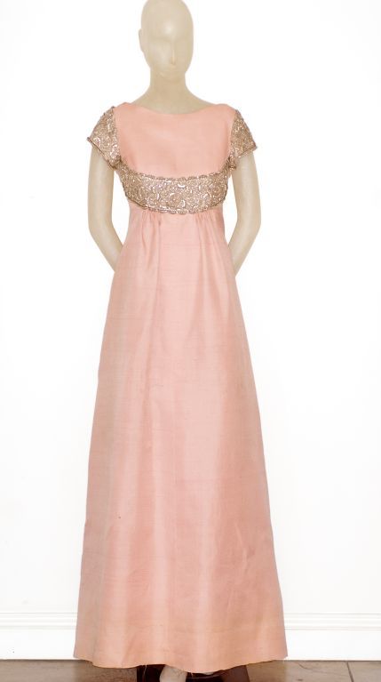 This is an extremely rare, very early 1960s Valentino Couture gown in a pale blush silk with a beautifully embroidered bodice.  Embroidered in silk and metal threads.  Very low back line.

Valentino Garavani is the most celebrated of all Italian