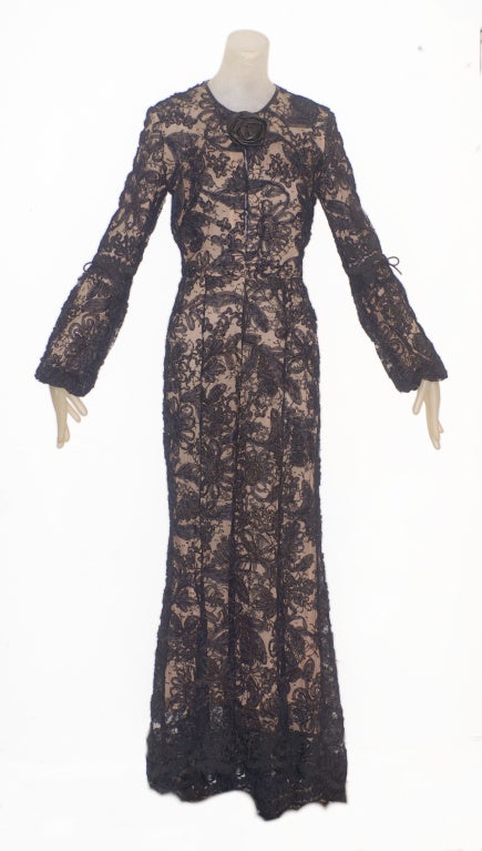 A rare and incredibly beautiful Tom Ford for Gucci black leather nude illusion lace gown with a leather 'flower' at the neckline.  1997. From one of Tom Ford's most iconic collections for Gucci.  Beautiful condition.  Lined in a nude color silk