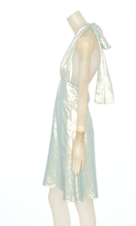 Shimmering sea foam green silk halter neck dress by Tom Ford for Gucci Fall 2000.

* Shimmering pale sea foam green dress
* Halter neckline. 
* Banded waist
* Side zip.
* Silk lining.
* Made in Italy
* Labeled Gucci
* Tom Ford for Gucci