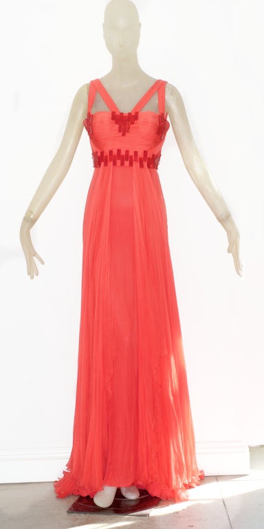 Coral chiffon gown with finely draped bodice.