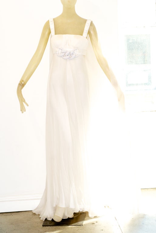 Versace white chiffon gown with large white chain detail on bodice.  Backless with flowing panels.