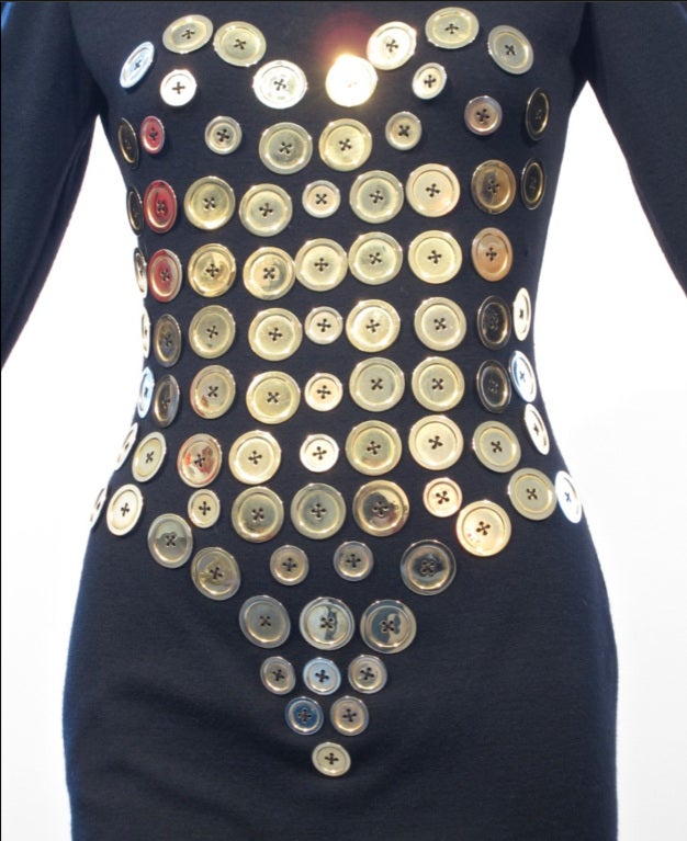A playful and iconic gold button dress by the Mississippi born Patrick Kelly soon to be celebrated in the upcoming exhibit Patrick Kelly: Runway of Love,  at the Philadelphia Museum of Art.  Kelly showed his first collection in Paris in 1985 and