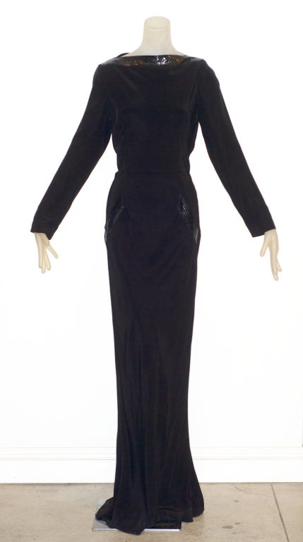 Fall 1996 John Galliano for Givenchy haute couture black crepe gown with python trim.  Dress is draped in the back.  Size 44.