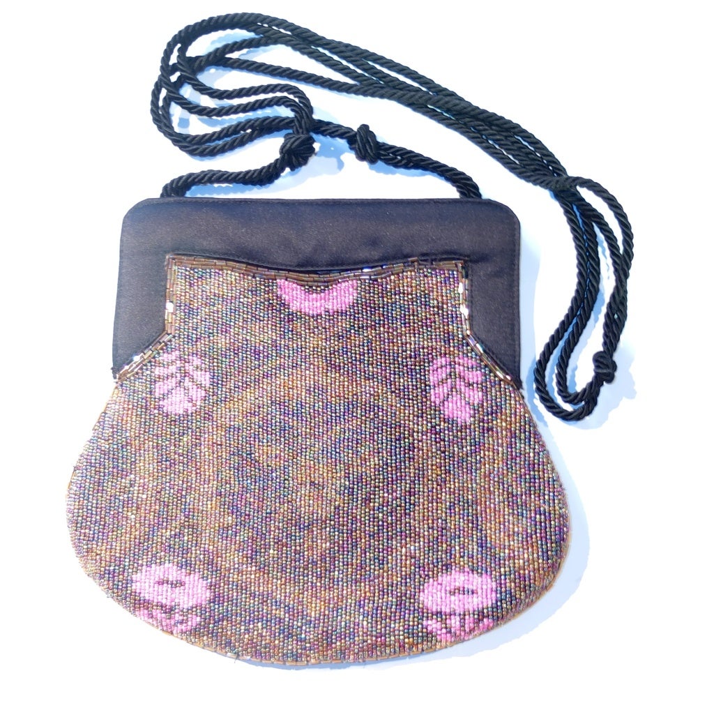 A pretty and practical (will hold more then just a phone and a credit card) beaded evening bag by Fendi.  The subtle pattern is accentuated with a burst pink.

RARE vintage
STORE HOURS: Monday to Friday 11:30 to 6PM
24 West 57th Street
Fifth