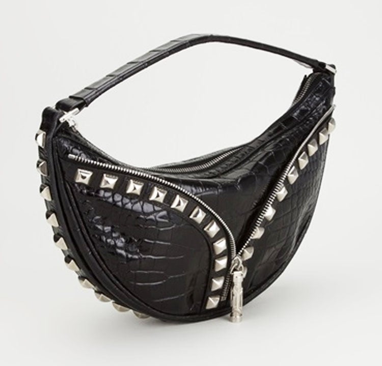 Rock Black crocodile leather clutch bag from Versace Vintage featuring a single top handle, a silver-tone top zip fastening, silver-tone pyramid stud detailing and a black silk lining. 
Marked: Versace Made in Italy. Mint condition. Size: 32 x 17