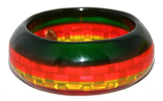 A Rare model of bracelet cuff made by Christian Lacroix. Just Ideal for this summer !! Red, Orange, Yellow and Green striped Resin bracelet cuff. circa 1988-89. Excellent vintage condition. Size: wide: 3.2 cm- 1 1/3 in. Inside Diameter: 6.4 cm - 2