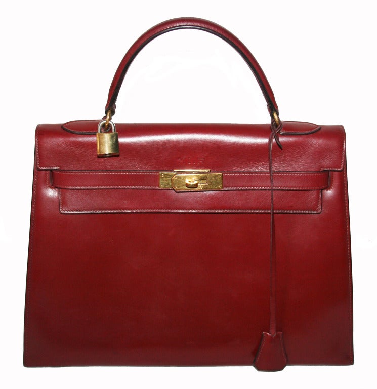 Just Divine... Iconic Sixties Hermes Grace Kelly Handbag, box leather, burgundy, circa 1960, letter Y. Historical piece in gorgeous vintage condition. Unique and initially made for 'MLR' Parisian Lady. Size: 32 cm.
