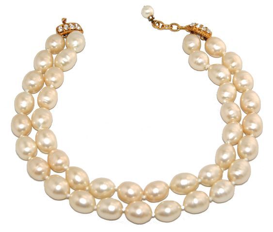 The Chanel Elegance. Gorgeous and rare double strands necklace of baroque pearls, gold plated metal and crystal swarovski. Excellent condition. Marked: Chanel 2 9, made in France. Size: Max length: 45 cm - 17 3/4 in, wide: 3 cm - 1 1/5 in.