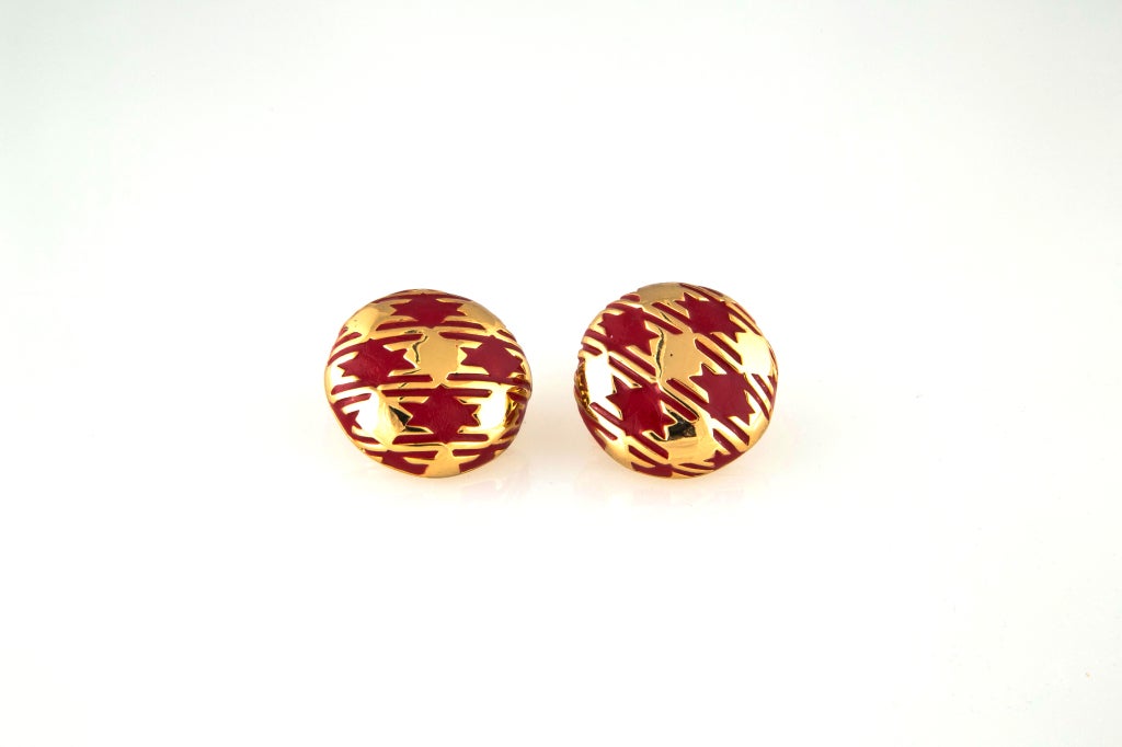 Brilliant red and gold plated hounds tooth earrings.  Clip earrings display the signature sophisticated enameling technique for which LANVIN was known in the 70?s yet so modern today.  LANVIN PARIS cartouche inside dome.