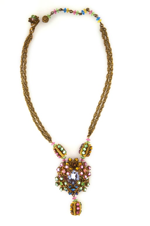 MIRIAM HASKELL necklace sparkling with jeweled Swarovski crystals.  Hand and prong-set faceted rose, peridot, citrine and center amethyst sapphire crystals are as dramatic as they are graceful.  Large central medallion suspends from 2 jeweled