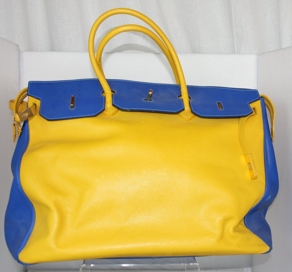 large scale chromium yellow and cobalt blue finely textured leather. Highly polished solid brass attachments w/ optional shoulder strap.
