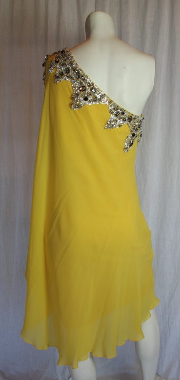 embellished with grey jewels and opalescent sequins... knee length...