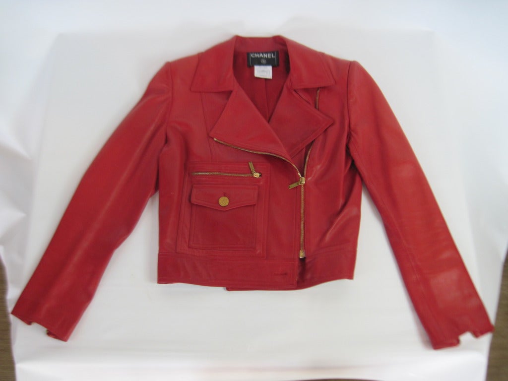 2001 Red leather lambskin biker jacket....Hardly worn, mint condition... Traditional style Biker Jacket with the great dark brass Channel buttons makes this s unique piece for any collector....