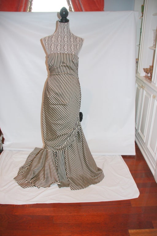 Gorgeous Ralph Lauren formal gown with train that has an equestrian flair. There is a prize winning type ribbon attached at side of train. This gown was featured on the runway and advertisements as well.