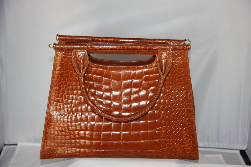 Lana Marks Brown Alligator Handbag, double handle with detachable strap. Envelope front compartment. Snap interior closure. Two interior pockets, one zip, one open.
