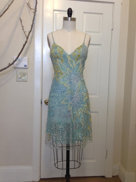 Ethereal summer beaded mini dress
Overall beaded design
Summer floral design in beads and sequins
Silk attached lining