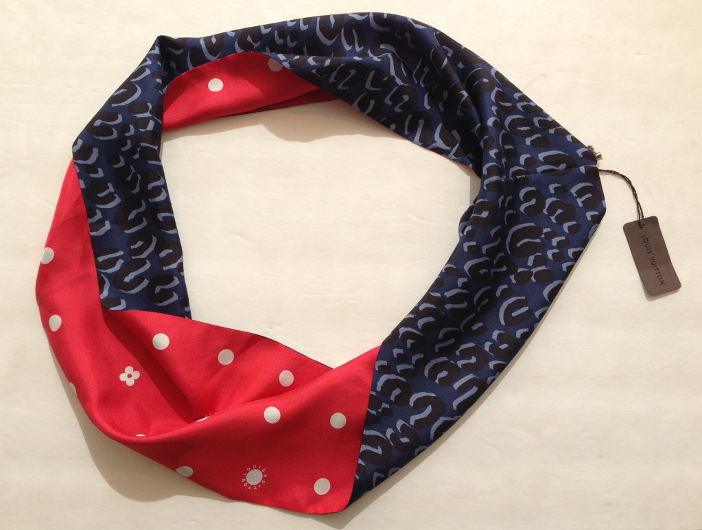 Pretty, bold patterns both inside and out, worn straight, twisted or twirled -- what fun! This reversible infinity scarf is brand new with tags still attached. Wear it at your neck or in your hair, and flip it throughout the day to match your