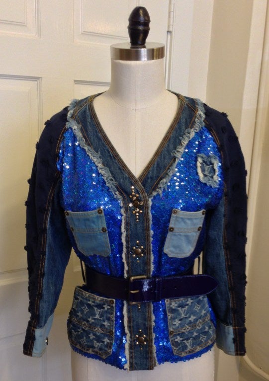 Have your denim jacket and sequins too! Mixed indigo textiles, iridescent sequins, brass and rhinestone details create a one-of-a-kind blend of Japanese boro style and modern glitz. Pair it with your favorite dark skinny jeans or a sleek black