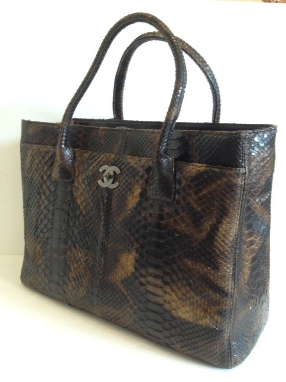 This bag is fierce. We don't usually play favorites, but this Executive is one of our favorite Chanel bags to date. The python exterior, dyed with a golden brown and chocolate marbled pattern, is just as stunning from across the room as it is up