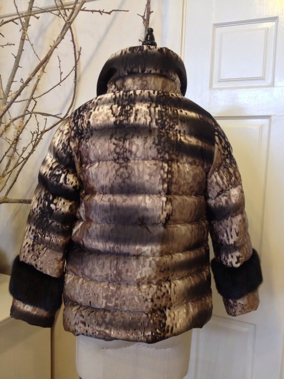 Even a Prada's puff pieces are sophisticated.

Soft black mink trims the collar and cuffs of this lightweight quilted down jacket. Matching nylon-covered buttons close the front.

We love the dappled tan and chestnut print, and seeing the