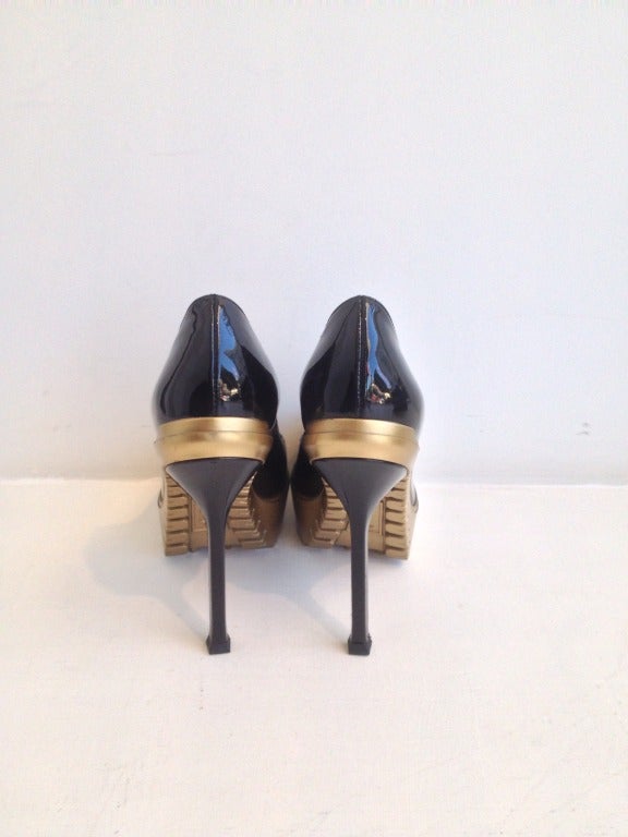 Take a walk on the wild side with these 4-inch heels featuring a gold platform tread.  These are a hot choice if you are looking for a glossy black patent heel that is a little unique.  The 1.25 inch platform gives height without hurt, allowing for